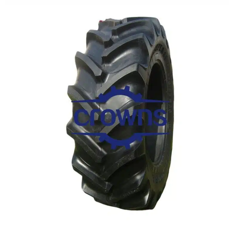 Robust black tire designed for agricultural machinery with durable tread pattern.