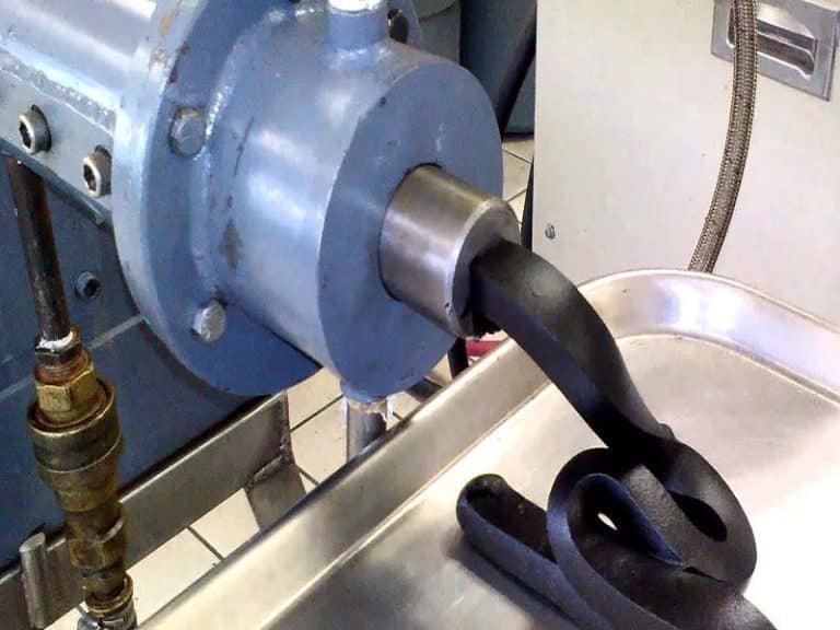 Close-up of rubber extrusion process showcasing the creation of durable materials