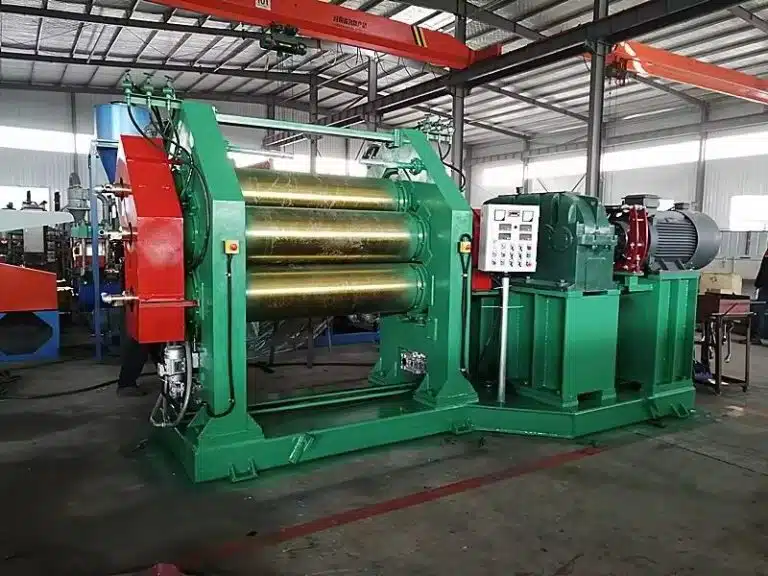 rubber calender machine at Crowns Machinery, equipped with large gold rollers and advanced control panel, used for precision rubber sheet production